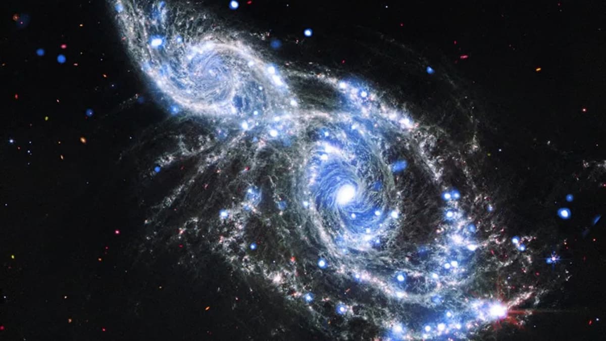 Space Telescopes Capture Breathtaking Galactic Hug | Space Photo of the Day for Jan. 8, 2026
