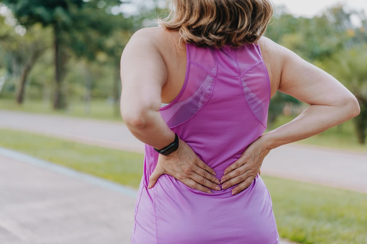 A Tight Back Can Throw Off Your Form. These 5 Moves Decompress Your Spine So You Run Better.