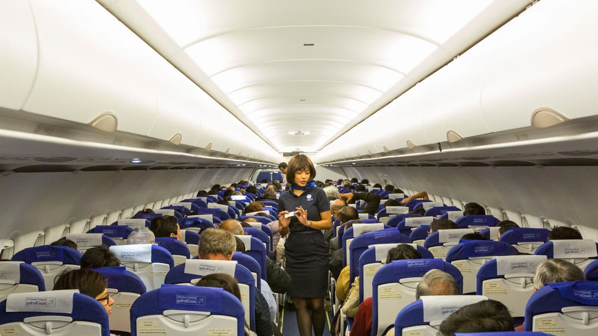Why Do Flight Attendants Sit on Their Hands?