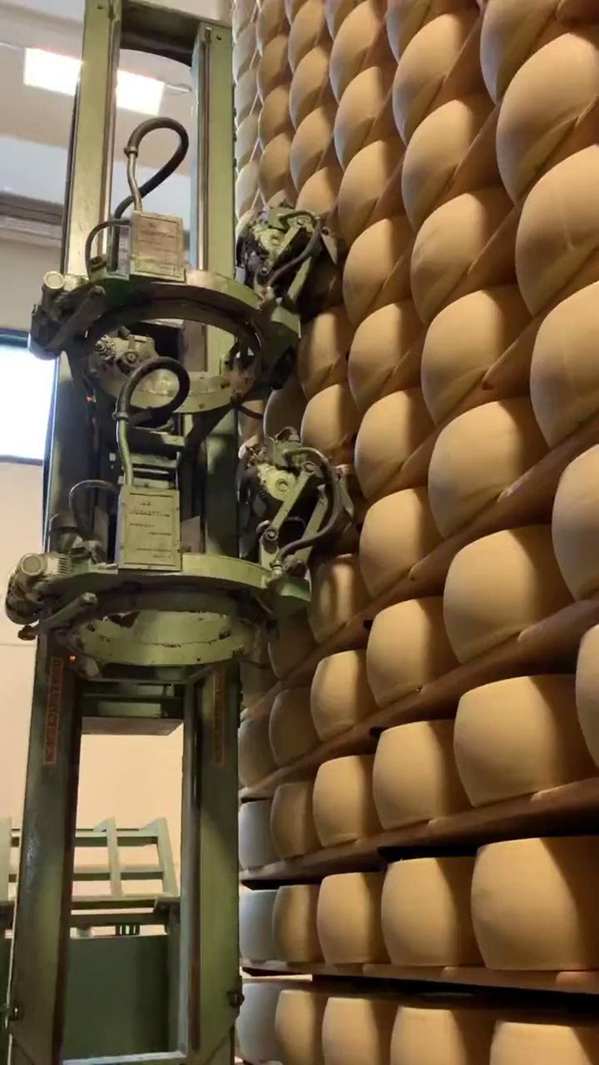 Robots Turning Cheese Blocks Threaten Traditional Cheesemakers