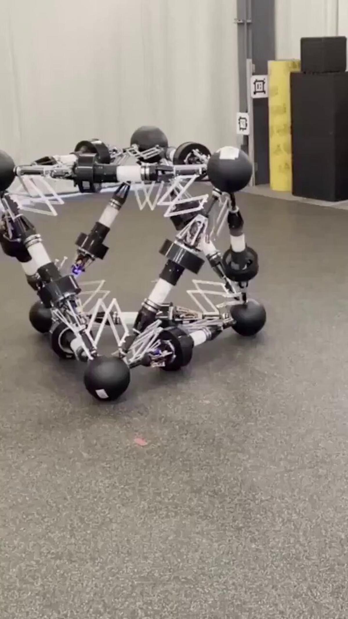 Reconfigurable Truss Robot Walks and Rolls in Pyramid
