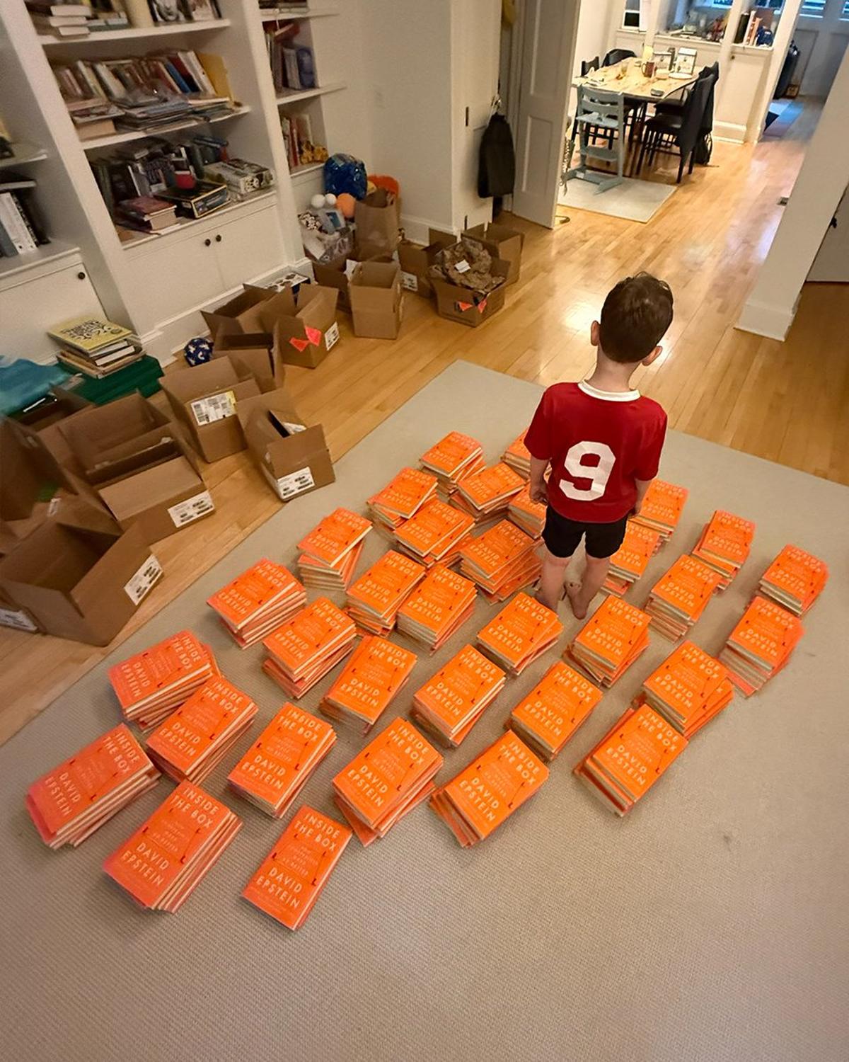 Son Thrilled by Orange Book Boxes, Turns Them Into Art
