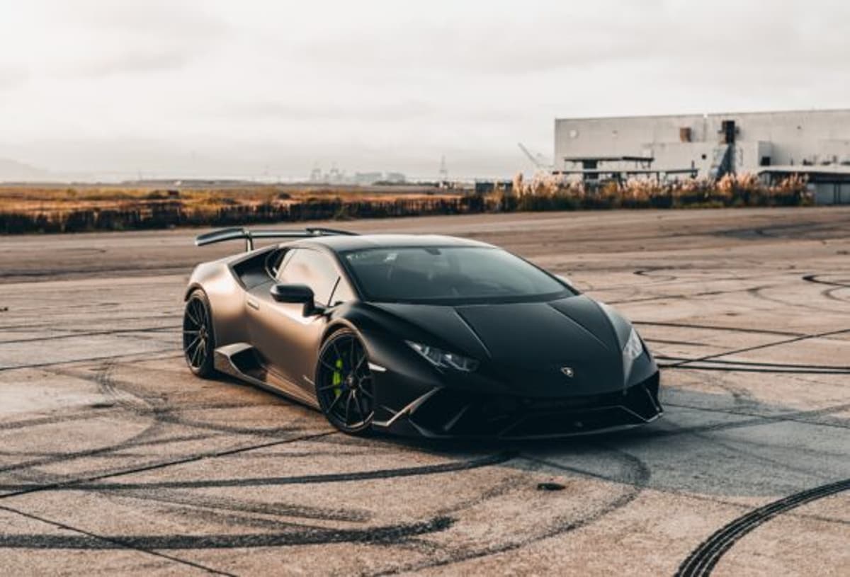 Florida Woman Drives Elevated Pickup Over Lamborghini Sports Car in Parking Lot