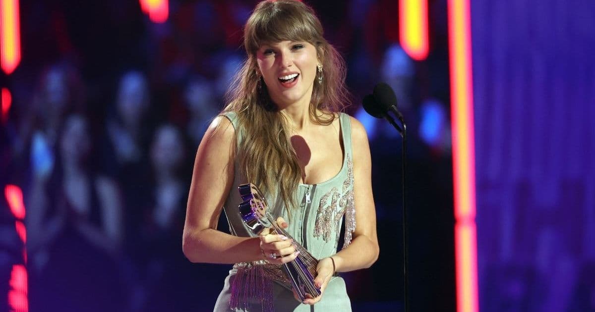 Taylor Swift’s Cami Top Hangs by 2 Strings Over Bridal Meshki Skirt